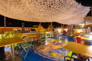 When night falls, our rooftop transforms into a captivating oasis. With soft lighting and breathtaking views, it offers a dreamlike setting for a memorable evening. at House of Wonders in Cascais