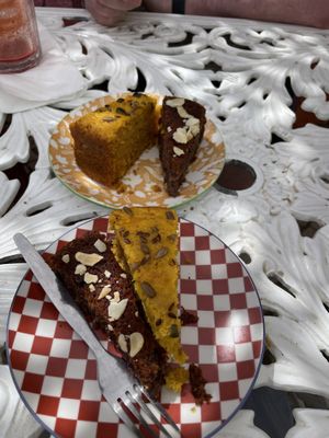Carrot cake and almond and berry . We shared a slice of each . Delicious   at House of Wonders in Cascais