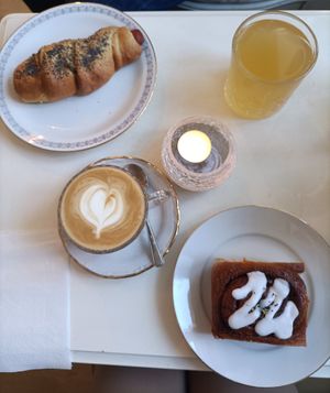 Glazed cinnamon roll, wurstel roll, cappuccino with soy milk and kombuca at Vegalicious Pastry in Helsinki