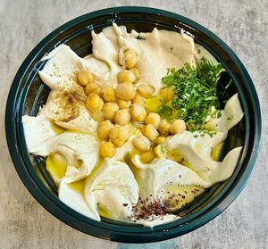 Hummus with seasoning  at Falafel Al Rabiah Al Khadhra - Al Taawun  in Sharjah