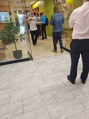 Kameel handing out free soup at Aviva by Kameel in Atlanta