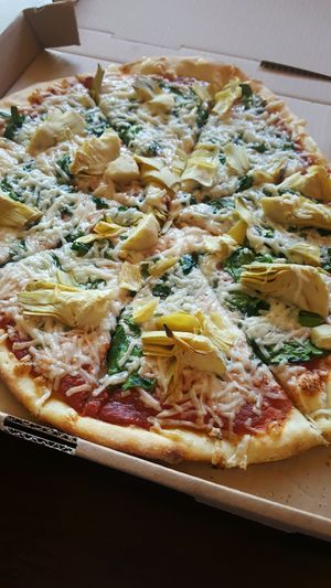 Spinach & Artichoke with vegan cheese + basil at Fresco Pizza and Grill in San Diego