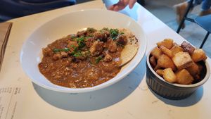 Sausage and gravy with seasoned potatoes at FiKA in Grand Rapids