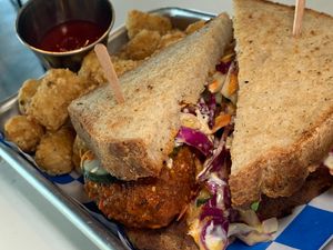 Hot Chik'n Sando: Battered & Fried Buffalo Tofu Chik'n, Creamy Slaw, House-Made Ranch, Sliced Pickles, Tater Tots at FiKA in Grand Rapids