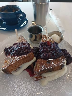 Stuffed cinnamon raisin french toast with blueberry compote. at FiKA in Grand Rapids