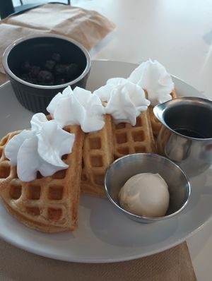 Belgian waffles with blueberries on the side. at FiKA in Grand Rapids