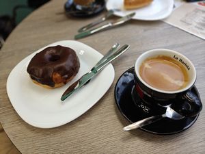 Café doppio y donut at Candy's Cafe in Granada