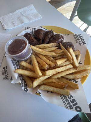 Lemon pepper wet wings with fries   at Mission Burger Co. in Atlanta