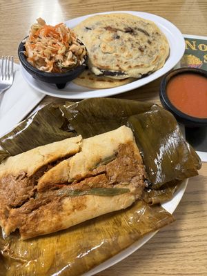 guatemalan tamal and some pupusas in the back  at Vegatinos  in North Hollywood