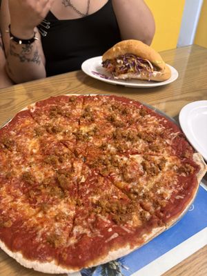 Happy hour pizza with meatballs and torta with Al pastor in back   at Vegatinos  in North Hollywood