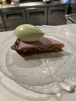 Fig leaf sorbet on top of a marzipan cherry tart slice.  at Smith & Daughters in Collingwood