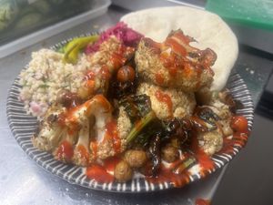 Sriracha and lime cauliflower, chickpea and kale bake with tabouleh and flatbreads  at The Deli Social in Sutton Coldfield