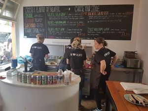 Menu and friendly staff at We Love Falafel in Brighton