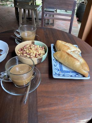 Breakfast (coffee, banh mi, and spicy corn)  at Yên Homestay & Vegan Macrobiotic in Hoi An