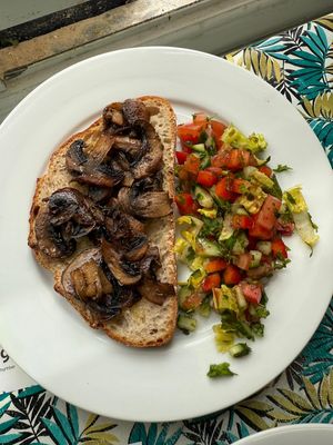 Mushrooms on sourdough toast with a side salad. at Dove Cafe in St Leonards