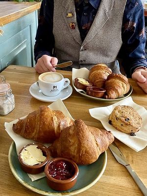 Croissants, a scone, and a cappuccino: a concert of European breakfast options. 😉  at Koffie ende Koeck in Amsterdam