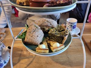 Afternoon tea, bottom layer: sandwich, quiche and spinach pie at Koffie ende Koeck in Amsterdam