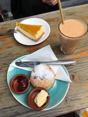 Vegan mango passion fruit cheesecake and vegan scone  at Koffie ende Koeck in Amsterdam