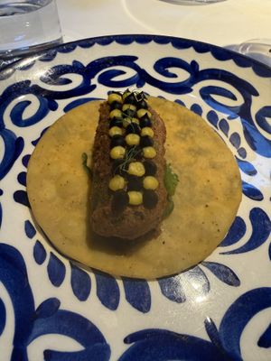 Fried avocado taco with sauces on top  at Californios in San Francisco