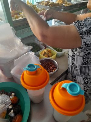 Preparing my take away vegan food at Quán Chay Xanh Vegan in Ho Chi Minh City