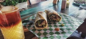 Burrito y si lo acompañas con la deliciosa salsa de morita/cacahuate 😋 y una refrescante naranjada de café at VeganBarrio in Cozumel