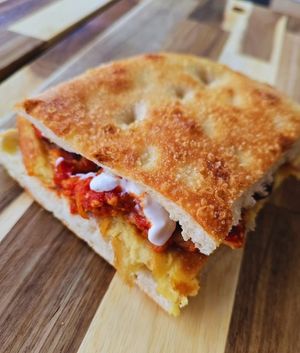 Cecino Parmigianino: chickpea farinata, eggplant parmigiana, and vegetable stracciatella at Focacceria Cecino in Milan