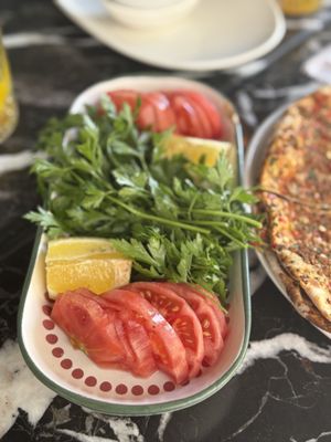 Herbs, tomatoes and lemon slices   at Casius Antioch Kitchen Restaurant in Istanbul