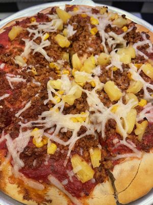 Vegan “ground beef” pizza with corn and tomatoes, super yummy!!  at Bottoms Up Pizza in Richmond