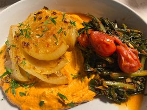 Roasted Onion over Romesco served with sautéed dandelion greens cherry tomato and some flat bread(not pictured)YUM!!! at Ian and Angela in Sedona