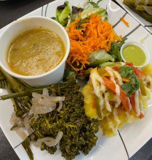 Roasted Broccolini, mash potato topped with fajita peppers and cumin creme, a green salad with cilantro lime dressing and Hypocrites soup.  at Ian and Angela in Sedona