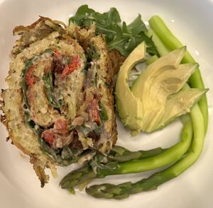 SOS Zucchini potato Pinwheel with arugala sun dried tomato and cashew cheese with steamed asparagus and avocado.  at Ian and Angela in Sedona