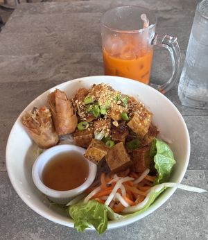 Lemongrass vermicelli noodles with tofu snd veg spring roll, and thai iced tea with coconut milkk  at Tin Corner in Frederick