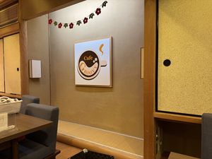 Interior with restaurant logo  at Cafe Groovy in Nara