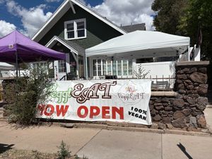 "Now Open," but look closely in the background: "Sorry, we're closed." at VeggiEAT  in Flagstaff