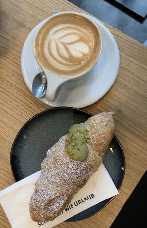 Pistachio cornetto and oat milk cappuccino 🫶  at Grey Kaffee - Pilgramgasse in Vienna