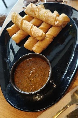 Vegan cheese sticks with pesto like tomato sauce at Yummy Brunch in Malaga