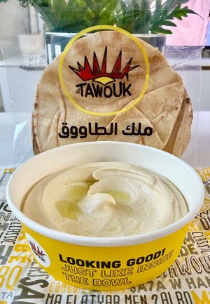 Hummus and bread  at Malak Al Tawouk - Motor City in Dubai
