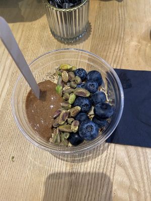 Build your own acai bowl with vegan granola, blueberries, pistachio and almond butter.   at ORA Wellness Cafe in Norwich