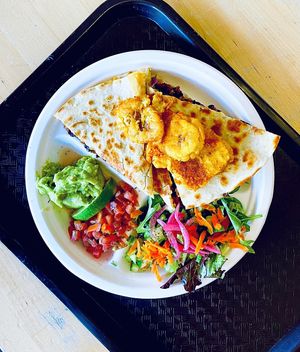 Blessadilla. Chili Beans, peppers & onions, salad, plantains, guacamole, pico de gallo, cheese  at Rhythm 'n Wraps in Boston
