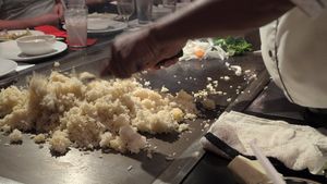 Tam cooking our meal at Kobé Japanese Steakhouse - Kirkman in Orlando
