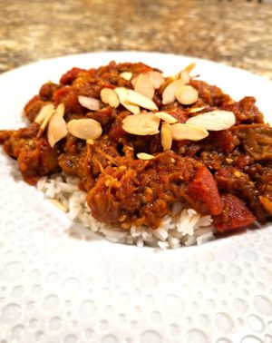 Moroccan Zaalouk over Coconut Rice, topped with Toasted Almonds at Mondano in Old Forge