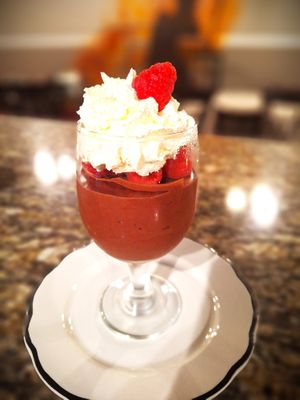 Vegan Chocolate Mousse made with aquafaba, vegan chocolate, and lentil-based cream, and served with fresh seasonal berries at Mondano in Old Forge