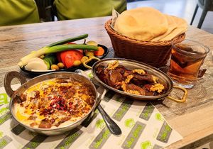 Syrian foul, makdous, raw vegetables, pita. at Baba Ghanouj - Al Barsha in Dubai