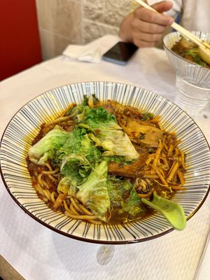 Soupe de nouilles épicée aux légumes   at Tintin - Bastille in Paris