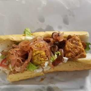 southern fried poboy11fried tofu, light chickpea flour breading, lettuce, tomato, vegan mayo, poboy bread at Seed - Faubourg Lafayette in New Orleans