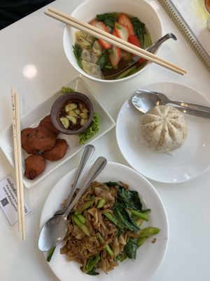 Wonton soup, bao bun, noodle dish and fish cakes   at The Rice and Healthy Food ข้าวทิพย์ แอนด์ เฮลท์ฟู้ด in Bangkok