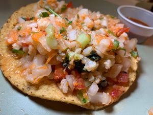 Cauliflower Ceviche Tostada: Cauliflower, Tomatoes, Onions, Cucumbers, Cilantro, Serrano Peppers, Nori, Lime & Salt on Fried Corn Tortilla (Kalamazoo Vegan Chef Challenge 5/25)  at Matchacita in Kalamazoo