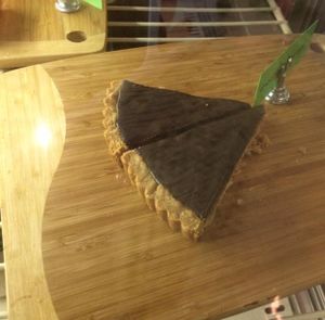 DELICIOUS Chocolate Walnut Tart! House made. Chocolate so smooth on top of a layer of chocolate chunks, crushed walnuts and terrific crust!  at Bloom Cafe in Los Angeles