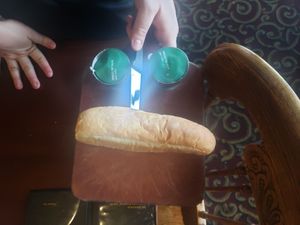 The large portion entree came with bread, a green salad or minestrone soup, and an ice cream. Our server, Gabriel, made me a raspberry sno cone. at The Old Spaghetti Factory in Banff