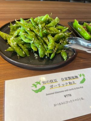 Edamame with homemade salted koji and garlic at Vege Table in Mishima